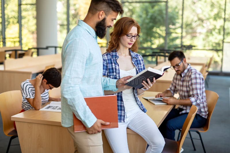 Happy Group Of Students Studying And Working Together In A College happy-group-of-students-studying-and-working-together-in-a-college