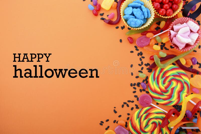 Halloween or Childrens Birthday candy favors on a bright orange background with decorated borders and copy space. Halloween or Childrens Birthday candy favors on a bright orange background with decorated borders and copy space.