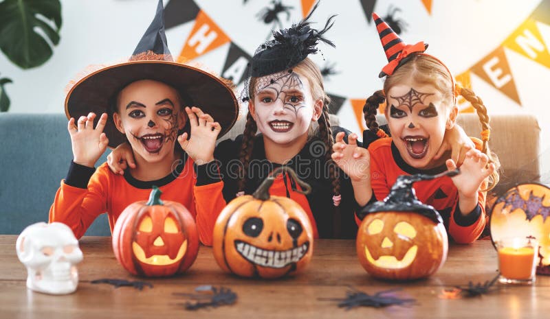Happy Halloween! a group of children in suits and with pumpkins stock photography Happy Halloween! a group of children in suits and with pumpkins stock photography