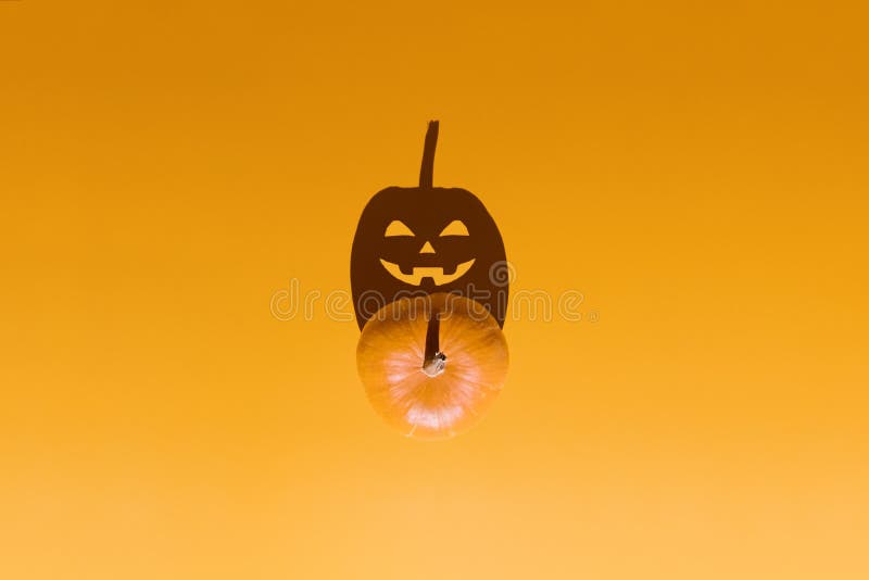 Happy Halloween minimal concept. Scary Jack O Lantern pumpkin with candle light inside stock photos Happy Halloween minimal concept. Scary Jack O Lantern pumpkin with candle light inside stock photos