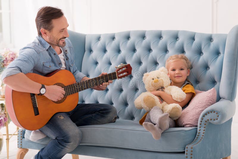 Happy handsome man playing the guitar stock photos Happy handsome man playing the guitar stock photos
