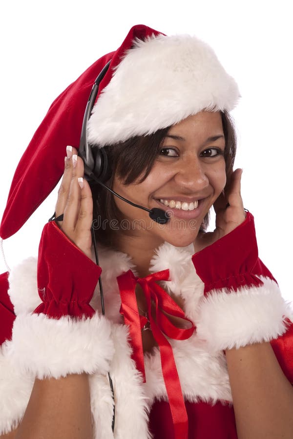 Santa's helper keeping in touch with a head set on her head. Santa's helper keeping in touch with a head set on her head.