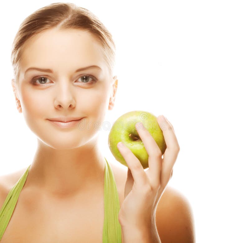 Happy healthy woman holding apple