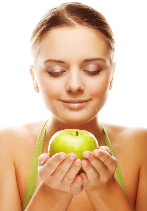 Happy healthy woman holding apple