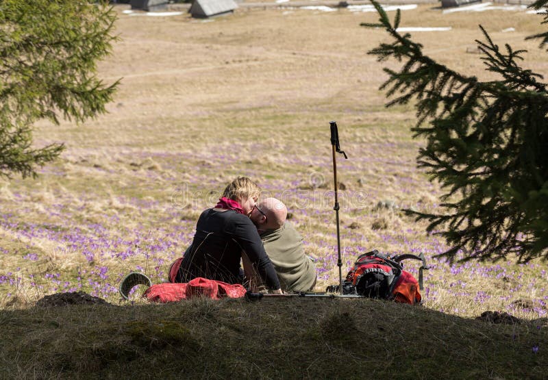 Happy hiking couple taking a break on mountain trail in Chocholowska Valley, Tatra, stock photos Happy hiking couple taking a break on mountain trail in Chocholowska Valley, Tatra, stock photos