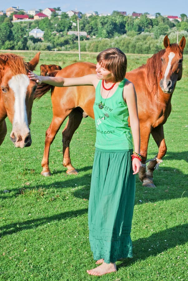 Happy hippie girl and horses