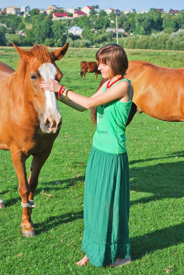 Happy hippie girl and horses