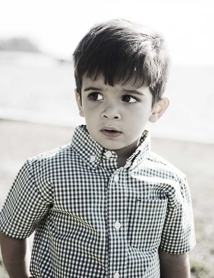 Happy hispanic boy with curious expression