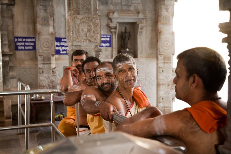 Happy indian priests in temple