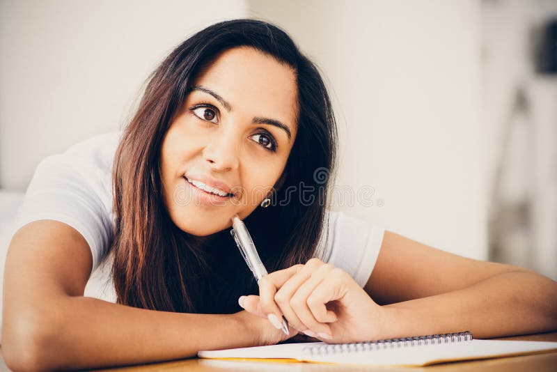 Happy Indian woman student education writing studying royalty free stock photo