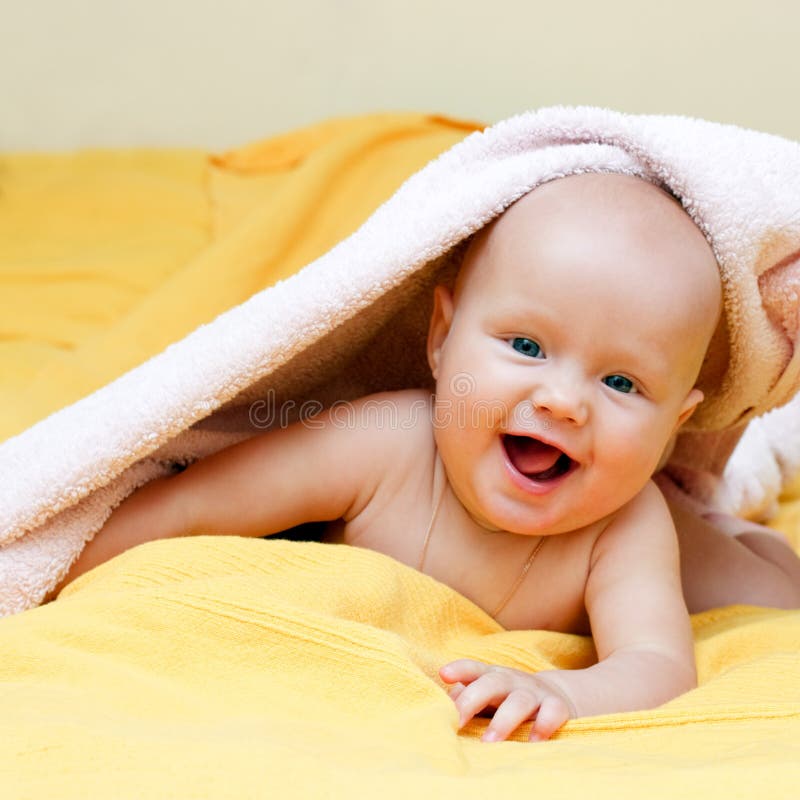 Amused Six Month Old Baby With Mom In Background Stock Image - Image of ...