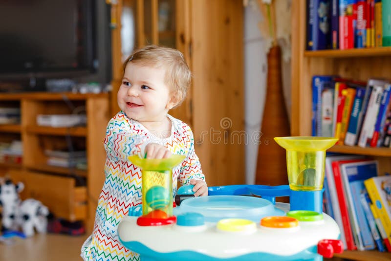 Happy Joyful Baby Girl Playing with Different Colorful Toys at Home ...