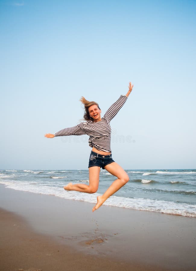 Happy jump stock image. Image of blond, beachfront, people - 26346755