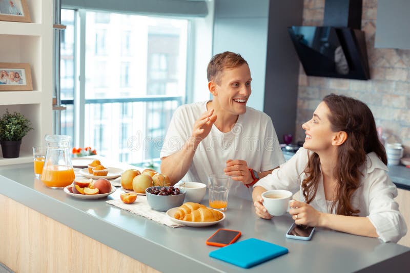 Happy just married couple enjoying breakfast together stock images Happy just married couple enjoying breakfast together stock images