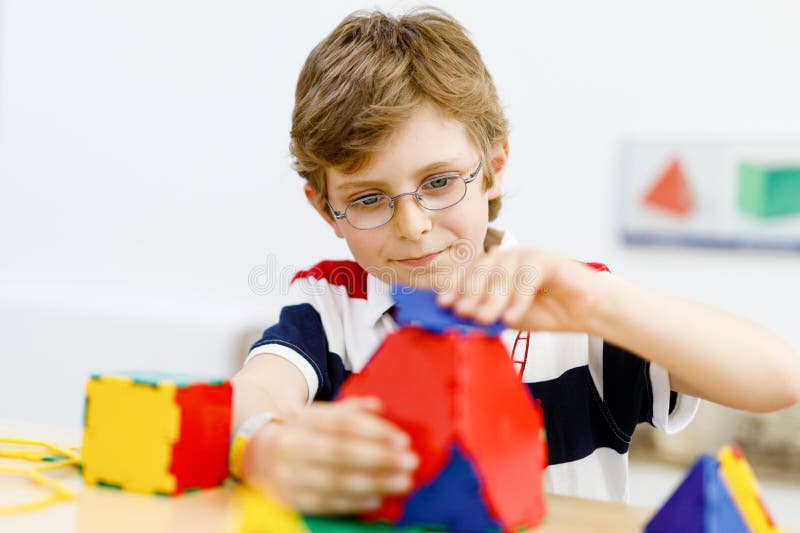 Happy Kid Boy with Glasses Having Fun with Building and Creating ...