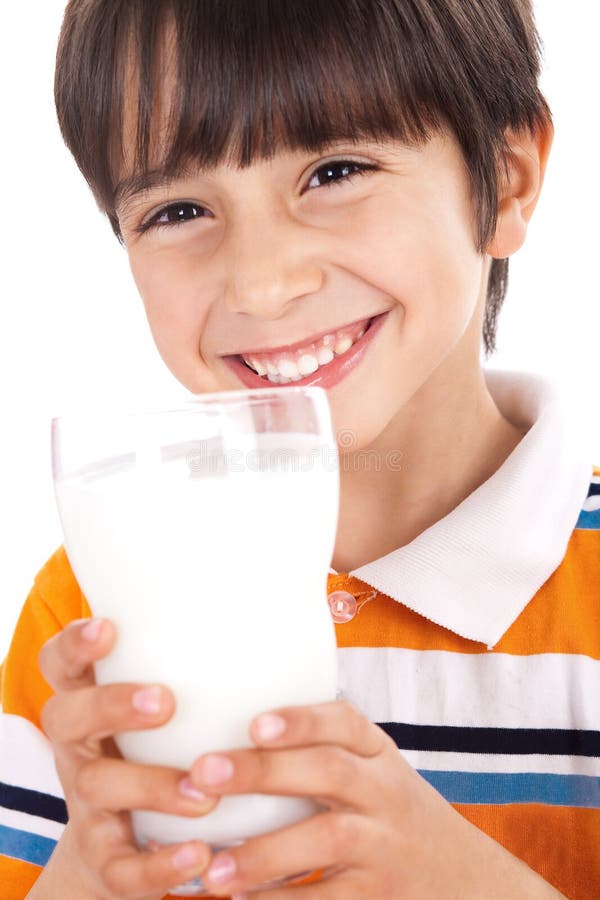 Happy kid drinking glass of milk