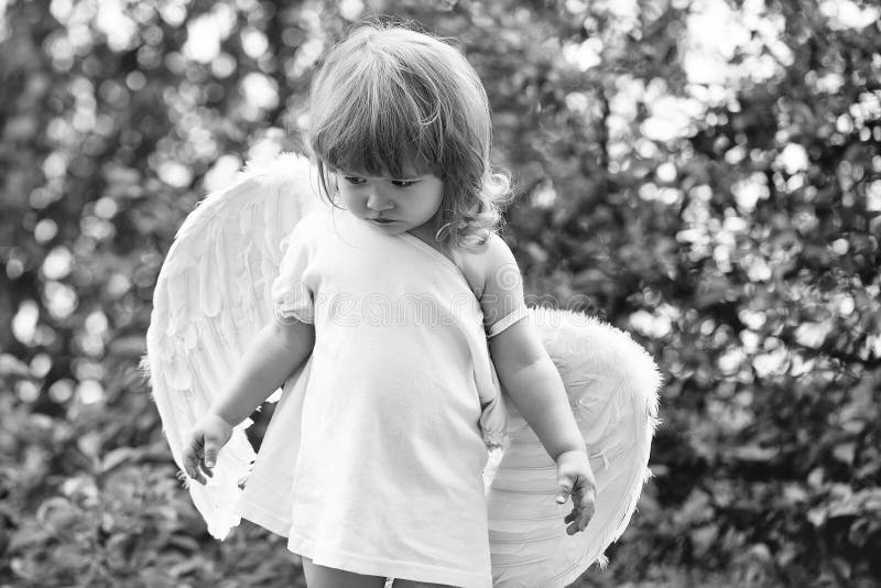 Happy kid having fun. small boy in angel wings royalty free stock image Happy kid having fun. small boy in angel wings royalty free stock image