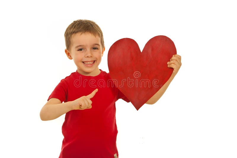 Happy kid pointing to heart shape