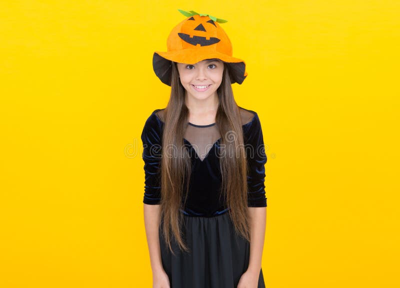 happy kid wear pumpkin hat on halloween costume party celebration at autumn traditional holiday of all saints, happy stock image