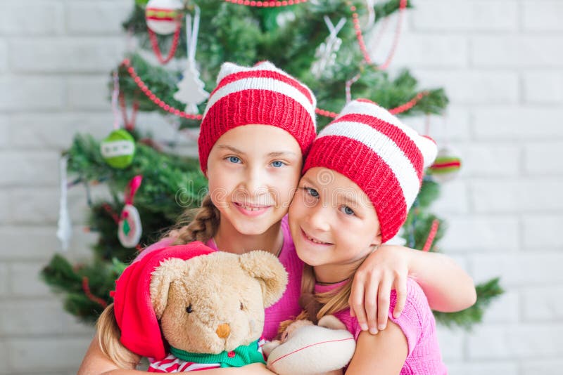 Happy kids near Xmas tree