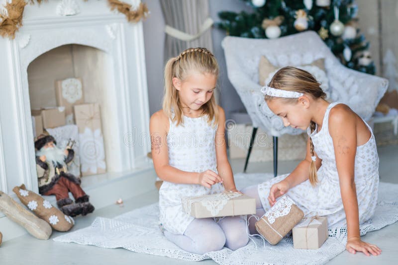 Happy kids near Xmas tree