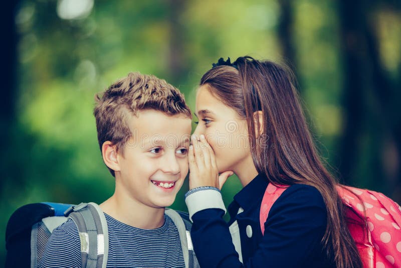 Happy Kids Whispering a Secret Each Other in the Ears Stock Image - Image of pupil, backpack: 178615173 Happy Kids Whispering a Secret Each Other in the Ears Stock Image - Image of pupil, backpack: 178615173