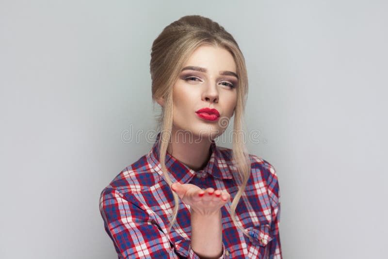 Happy kind blonde beautiful girl with pink checkered shirt, coll stock photography Happy kind blonde beautiful girl with pink checkered shirt, coll stock photography