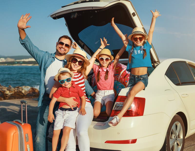 Happy large family mother father and children in summer auto journey travel by car on beach. Happy large family mother father and children in summer auto journey travel by car on beach