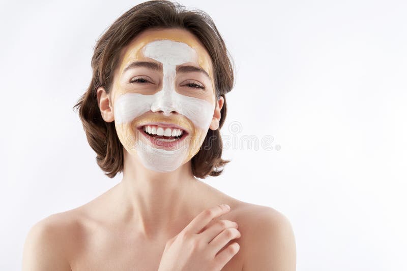 Happy Laughing Pretty Woman with Face Mask Stock Photo pic