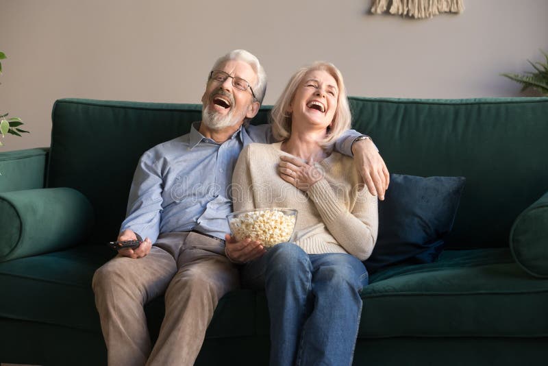 Excited Mature Couple Laughing while Watching Comedy Movie. Stock Image - Image of leisure, excited: 157925417 Excited Mature Couple Laughing while Watching Comedy Movie. Stock Image - Image of leisure, excited: 157925417