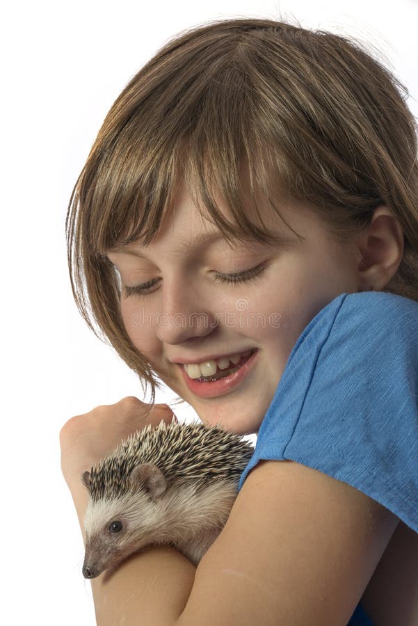 Happy litle girl with African pygmy hedgehog