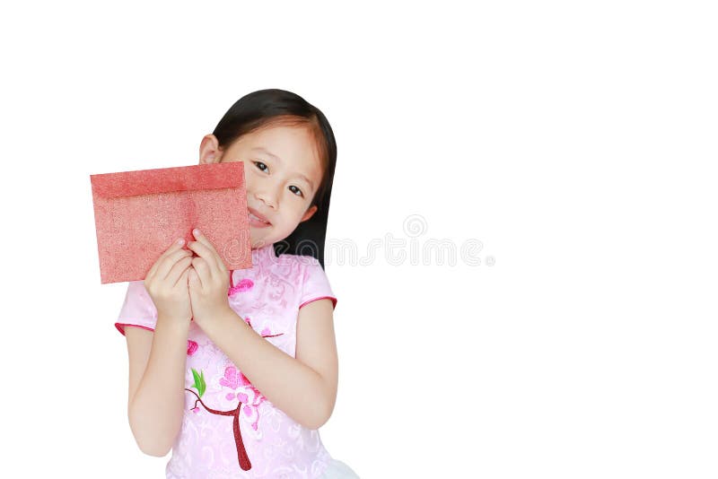 Happy little Asian child girl wearing pink traditional cheongsam dress smiling while receiving Chinese New Year red envelope stock photos Happy little Asian child girl wearing pink traditional cheongsam dress smiling while receiving Chinese New Year red envelope stock photos