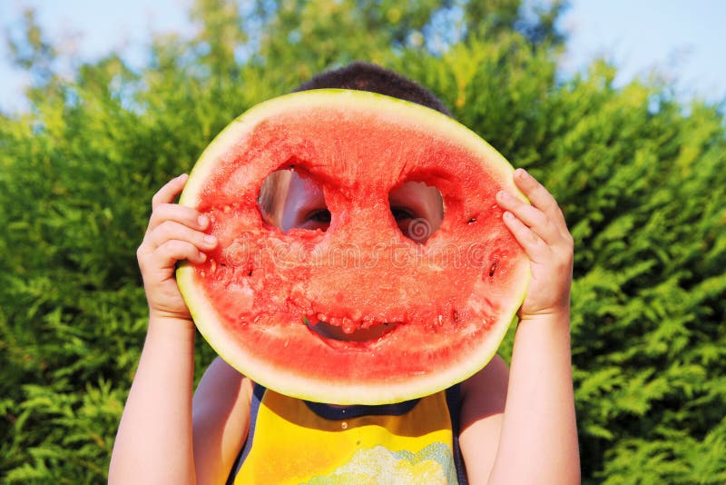 Happy little boy with watermelon