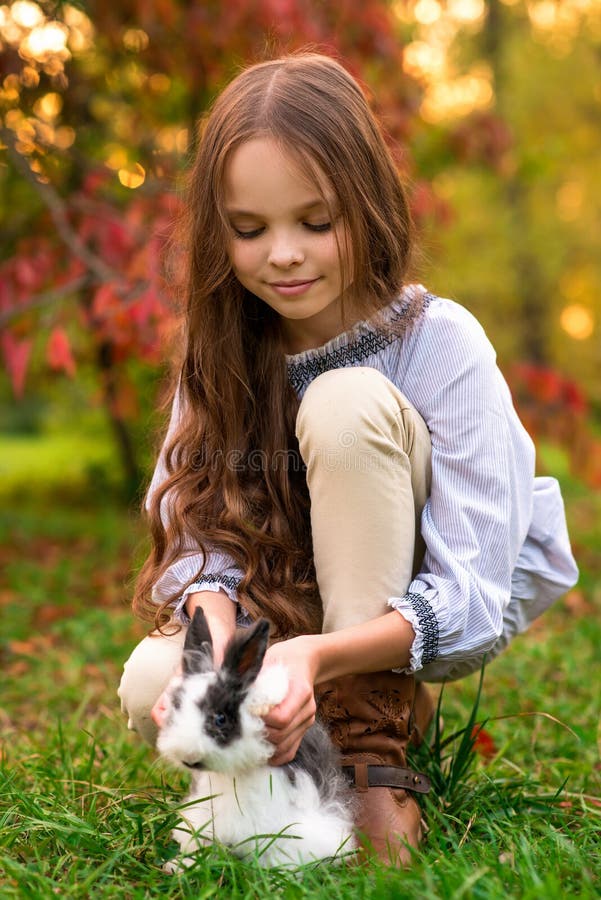 https://thumbs.dreamstime.com/b/happy-little-child-girl-cute-rabbit-portrait-kid-pet-outdoors-happy-little-child-girl-cute-rabbit-portrait-230011568.jpg