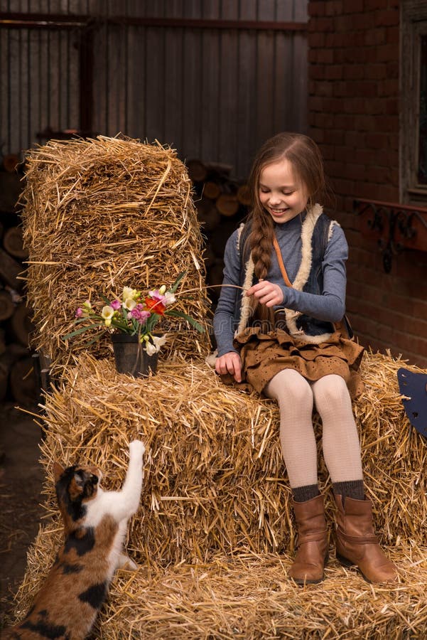 https://thumbs.dreamstime.com/b/happy-little-child-girl-playing-cat-farm-portrait-kid-pet-sitting-hay-outdoors-happy-little-child-girl-220621588.jpg