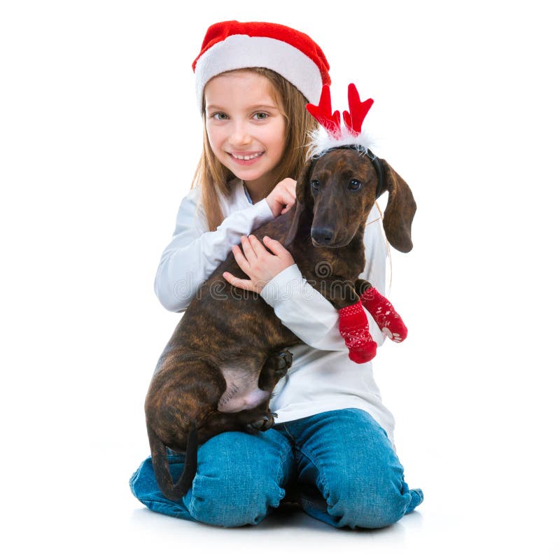 Happy little cute girl with a dachshund