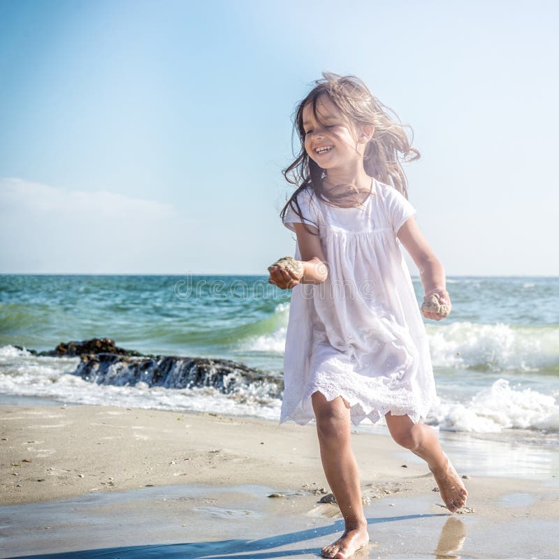 Happy Little Girl on the Beach Stock Photo - Image of coastline, girl ...
