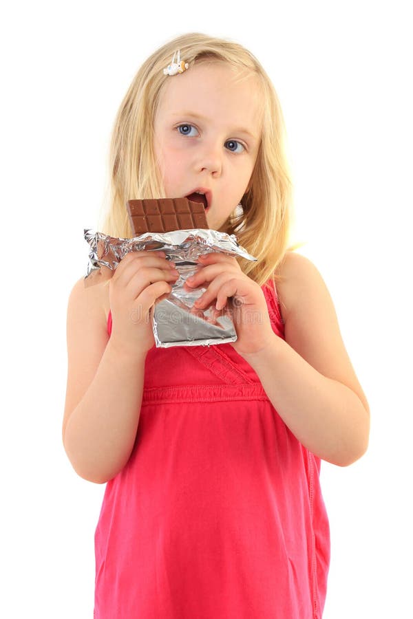 Happy little girl eating chocolate stock images Happy little girl eating chocolate stock images