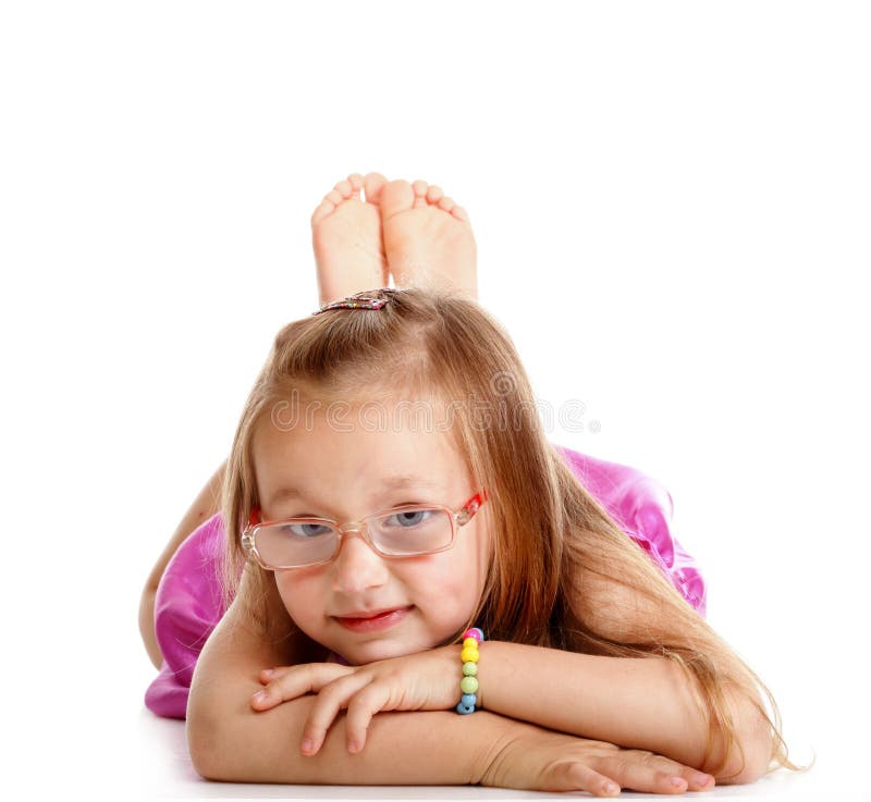 Happy little girl laying on floor isolated