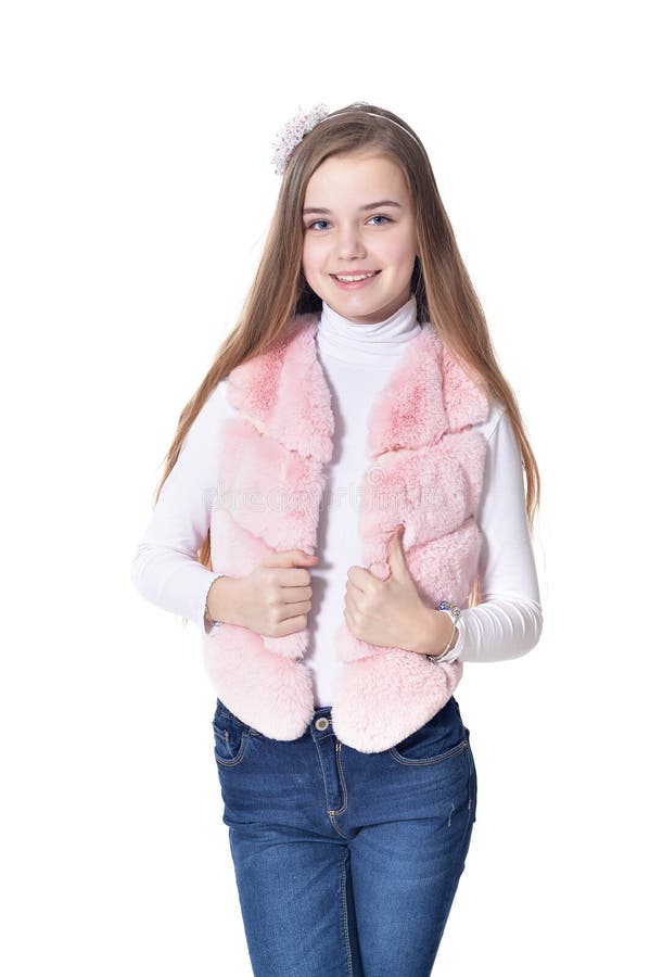 Happy little girl in pink fur vest posing