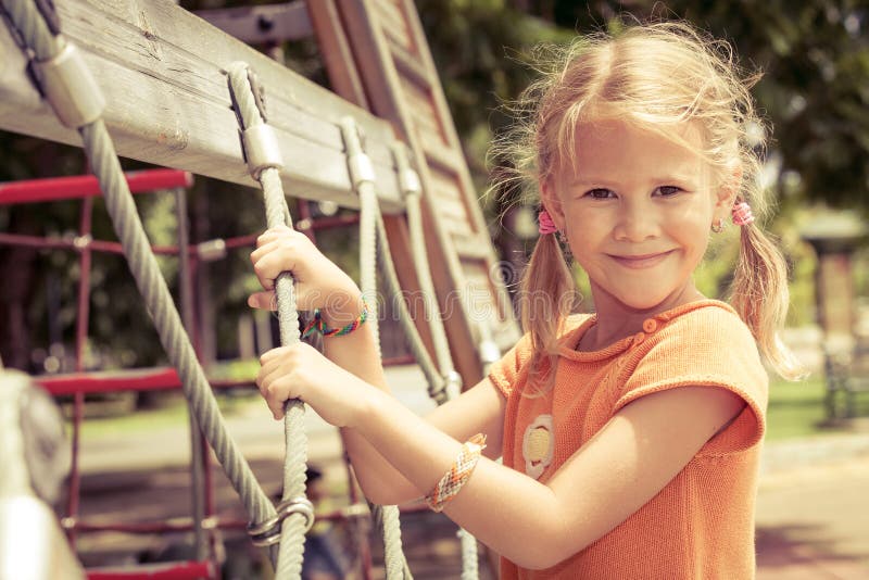 Happy little girl on the playground