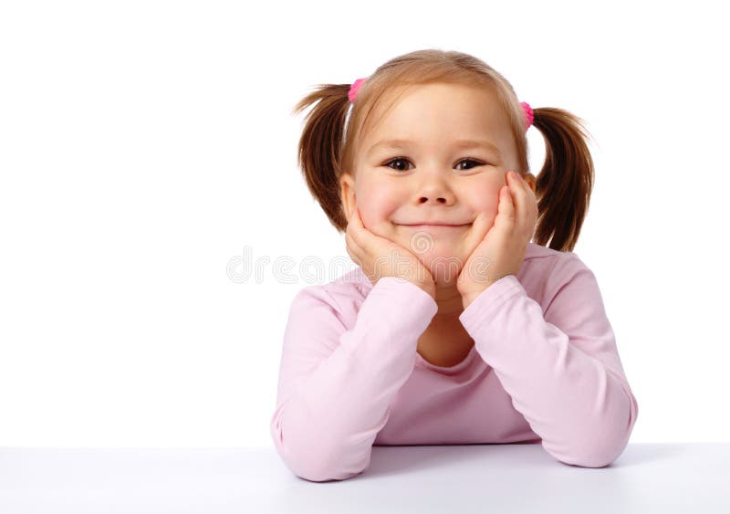 Happy Little Girl Sits at a Table and Smile Stock Image - Image of ...