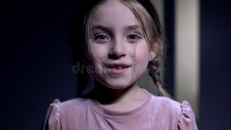 Happy little girl smiling on camera, excited with good news, sincere emotions.