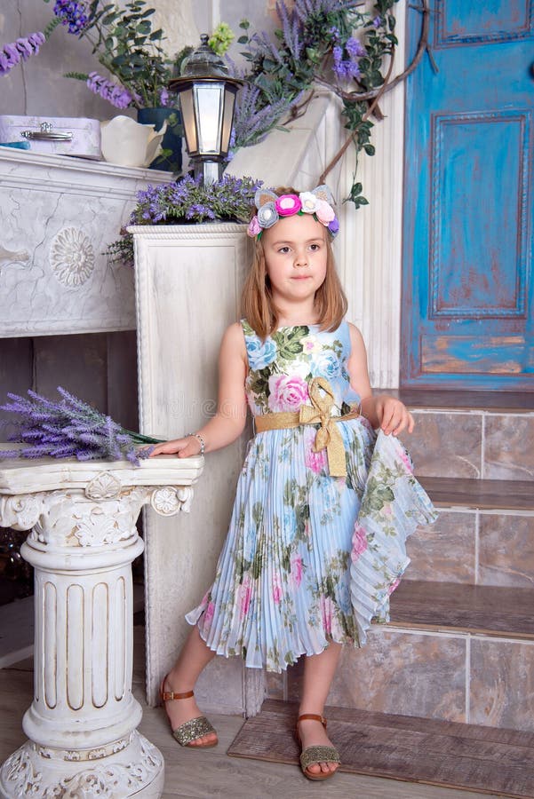 A young girl dressed in a ballet outfit sitting on her front porch Stock Photo - Alamy