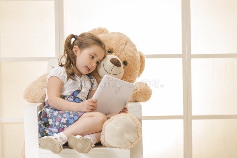 Happy little girl with Teddy bear stock photography Happy little girl with Teddy bear stock photography