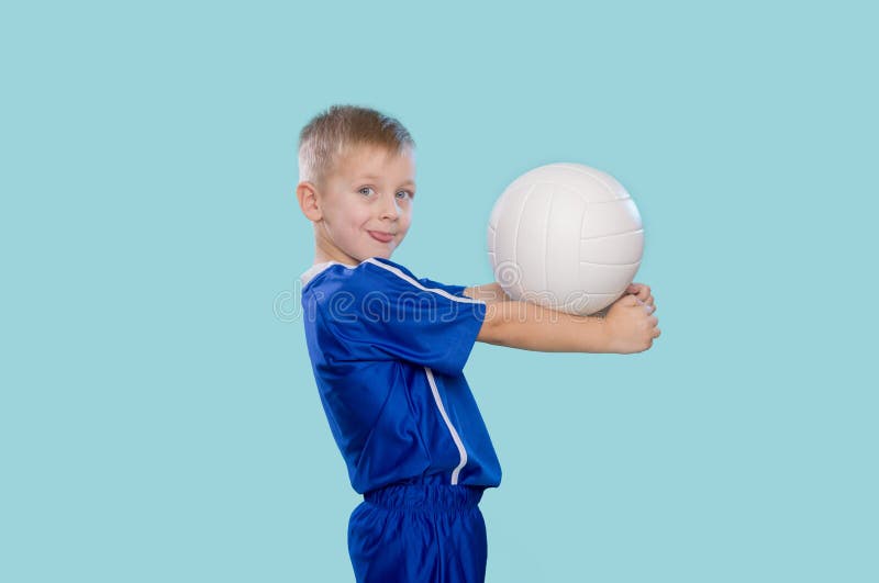 Happy Little Kid in a Blue Shirt with a Ball for Volleyball. Physical ...