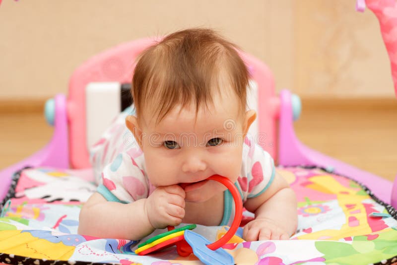 Happy little newborn baby with toys royalty free stock images Happy little newborn baby with toys royalty free stock images