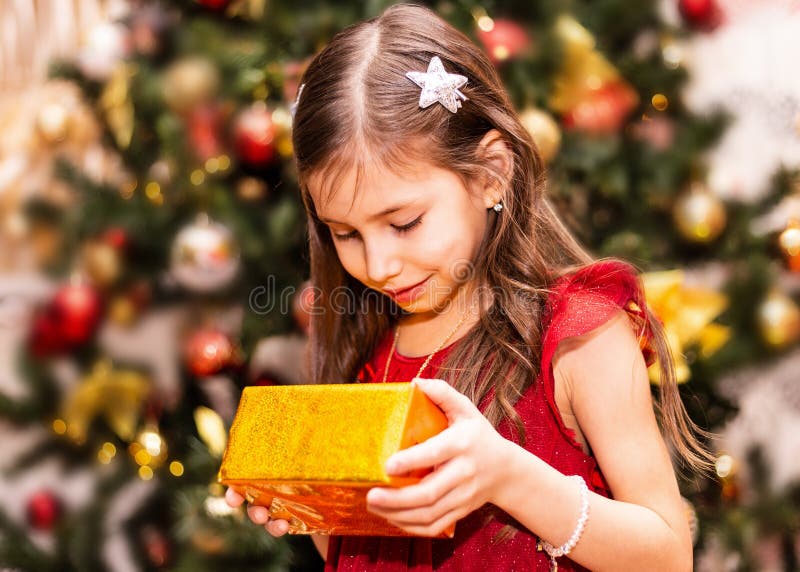 Happy little smiling girl with christmas gift box royalty free stock image Happy little smiling girl with christmas gift box royalty free stock image