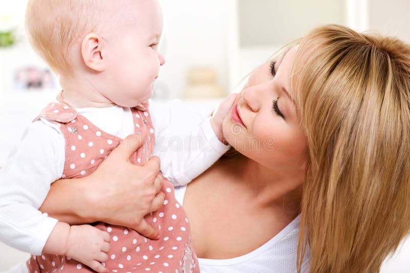 Happy loving mother with baby