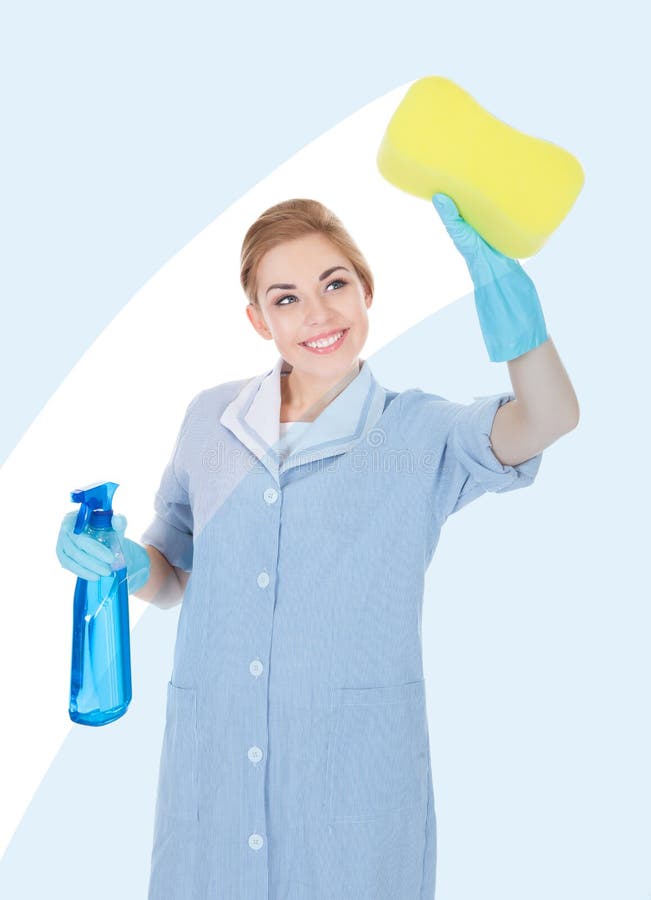 Happy Maid Holding Cleaning Liquid And Sponge royalty free stock image
